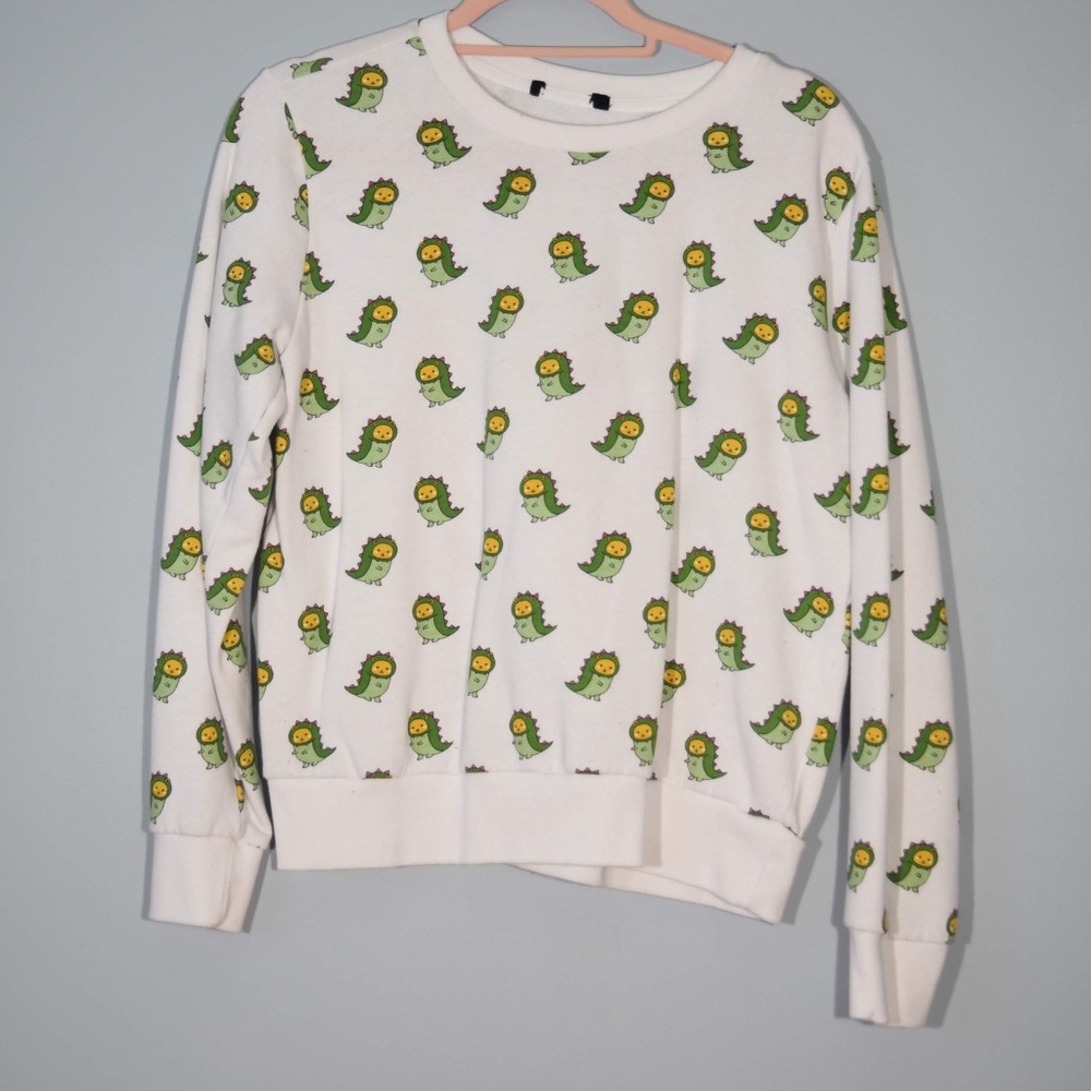 White with green dinosaurs sweatshirt